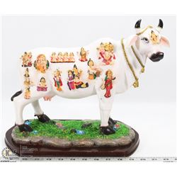 PAINTED CEREMONIAL STYLE COW FIGURINE.