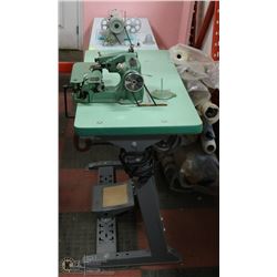 GROUP OF 2 INDUSTRIAL SEWING MACHINES WITH FABRIC
