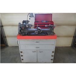 Atlas 22" metal cutting lathe w/ all tooling and work bench cabinet