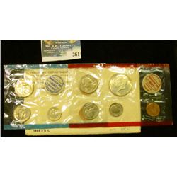 1969 U.S. Mint Set in original envelope and cellophane as issued. Includes Silver Half Dollar.