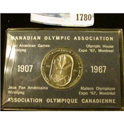 1780 _ Canadian Olympic Association 1967 Olympic Coin With Holder.  On The Front Is The Canadian Map