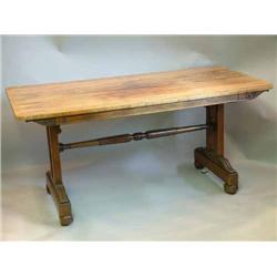 A late Regency rosewood writing table on rosette carved standard end supports with mid stretcher...