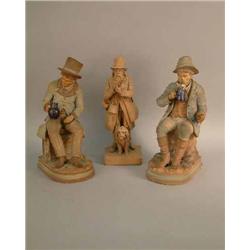 A pair of Austrian painted terracotta figures of topers 12in. and a similar figure entitled 'Diep...