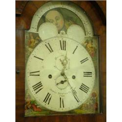 An early 19th Century mahogany 8 day longcase clock, the 16in. arched painted dial with moonphase...