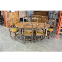 CARVED ANTIQUE CRANK DINGING TABLE W/ CRANK AND 2 LEAFS W/ 6 CHAIRS