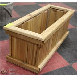 11"X27"X10"H CEDAR STAINED PLANTER.