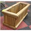 Image 1 : 11"X27"X10"H CEDAR STAINED PLANTER.