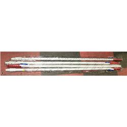 GROUP OF 4 RED AND WHITE BROOM HANDLES