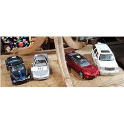 FOUR COLLECTIBLE DIE CAST CARS