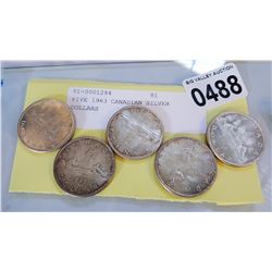 FIVE 1963 CANADIAN SILVER DOLLARS