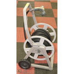 HOSE CADDY WITH RUBBER WATER HOSE.