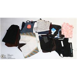 SHELF OF ASSORTED NEW WOMENS CLOTHING INCL. PANTS,