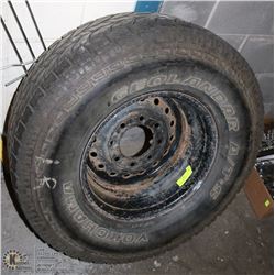 265/75R16 YOKOHAMA A.T. TIRE ON 8 BOLT GMC RIM.