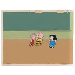 Charlie Brown, Lucy, and Linus production cels from a Peanuts cartoon