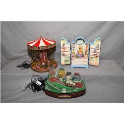 Two animatronic musical collectibles including "Swing Carousel" and and Ensco "My Favourite Things" 