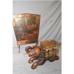 Art deco shield shaped copper fire screen and a carved elephant plant stand