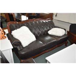 Semi contemporary button tufted full sized sofa with decorative show wood plus two decorative pillow