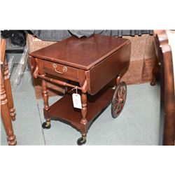 Semi contemporary mahogany drop leaf tea wagon with single drawer and pull up handle, made by Kneckt