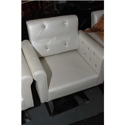 White hydraulic lift salon chair with diamante tufted upholstery