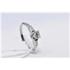 Image 1 : Ladies 18kt white gold and three stone diamond ring. Set with round brilliant 0.35ct diamond and two