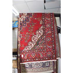 100% Iranian wool carpet with large center medallion and overall floral design, red background, high