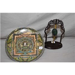 An Imperial reticulated green jade pendant and a Sino-Tibetan prayer plate