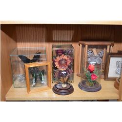 Shelf lot of collectible glass cased butterflies and flowers