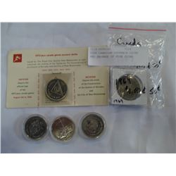 FOUR CANADIAN SOUVENIR COINS AND PACKAGE OF FOUR COINS