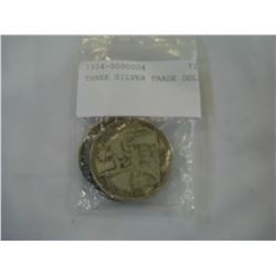 THREE SILVER TRADE DOLLARS