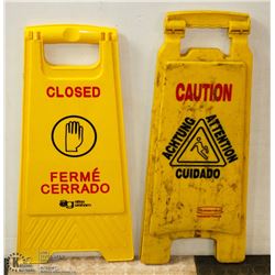 LOT WITH WET FLOOR SIGN AND CLOSED SIGN
