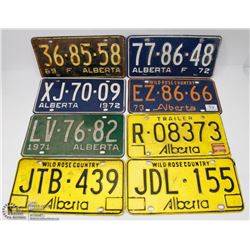 8 VINTAGE LICENSE PLATES.