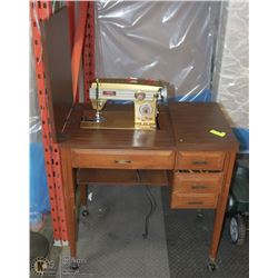 SEWING TABLE WITH SEWING MACHINE VINTAGE MODEL.