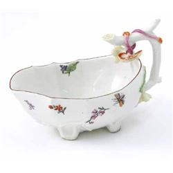 A Chelsea porcelain sauce boat, 'red anchor' period, 1752-56, moulded and painted with flower spr...