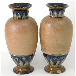 A pair of Royal Doulton stoneware vases, with moulded and incised detail, faults, 11.5in....