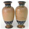 Image 1 : A pair of Royal Doulton stoneware vases, with moulded and incised detail, faults, 11.5in....