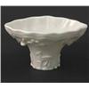 Image 1 : A Kangxi 'blanc de chine' libation cup, ivory-glazed and moulded with a leaping carp, a deer and...