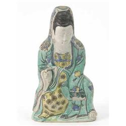 A 'famille verte' Guanyin, seated in long green robe, 8in....