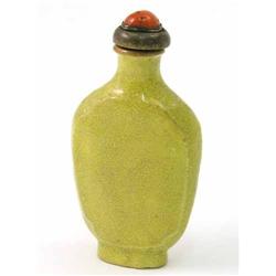 A Chinese monochrome yellow porcelain snuff bottle, of flattened ovoid shape, with pink coral and...