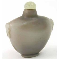 A Chinese grey and caramel agate snuff bottle, vase shaped with carved ring handles, jade stopper...