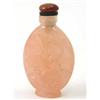 Image 1 : A Chinese rose quartz snuff bottle, carved with a seated boy, orange agate stopper, 3ins...