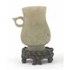 Image 1 : A Chinese white jade ring handled cup, carved with pi and scrolls, 4ins...