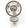 Image 1 : A Worcester polychrome tea bowl and saucer, of fluted shape, painted with a watermill and riversi...