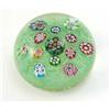 Image 1 : A mid 20th century Paul Ysart paperweight, with thirteen polychrome canes on a green ground, in o...