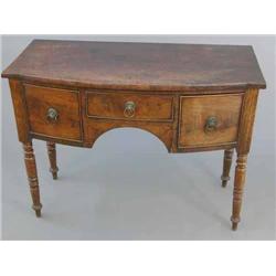 A small George III mahogany bow front sideboard, with central drawer flanked by two deep drawers...