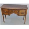 Image 1 : A small George III mahogany bow front sideboard, with central drawer flanked by two deep drawers...