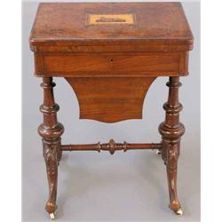 A mid Victorian walnut games/work table, the rectangular top inset with a Tunbridgeware panel of...