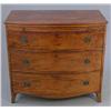 Image 1 : A George III mahogany bow front chest, of three graduated drawers, with brashing slide on splayed...