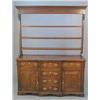 Image 1 : An early 19th century oak breakfront dresser, with triple shelf back over three real and three du...