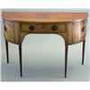 Image 1 : An early 19th century mahogany demi lune sideboard, with drawer flanked by two doors with octagon...