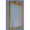 Image 1 : A Regency giltwood pier glass, moulded with paterae flanked by reeded columns, the bevelled plate...